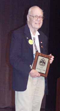 Hal Clement accepting the First Fandom Hall of Fame award for Arthur C. Clarke. Picture Copyright © 2002 by Suzanne Gibson.  All Rights Reserved.