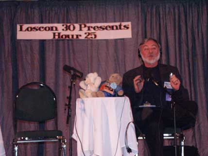 Warren opening Hour 25 at LosCon 30. Copyright ©2003 by Suzanne Gibson